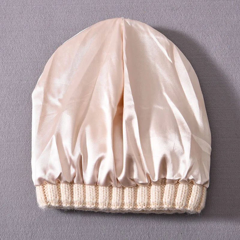 Beige Beanier cap with a ribbed base on a gray background