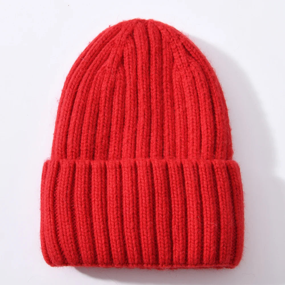 Red knit beanie on a white background