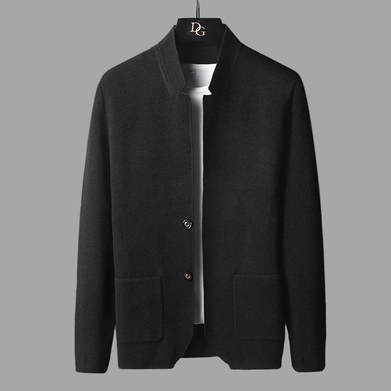 Black jacket on a gray background with a brand logo visible