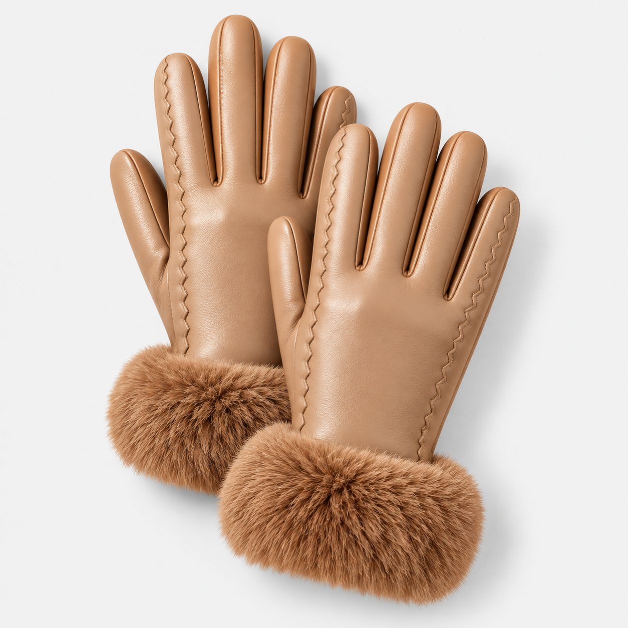 A pair of tan leather gloves with a fluffy brown faux fur cuff, displayed on a clean light gray background.
