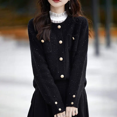 Woman in black button-front cardigan sweater, casual winter layering look
