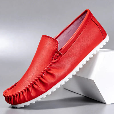 Red loafer shoe on a gray background