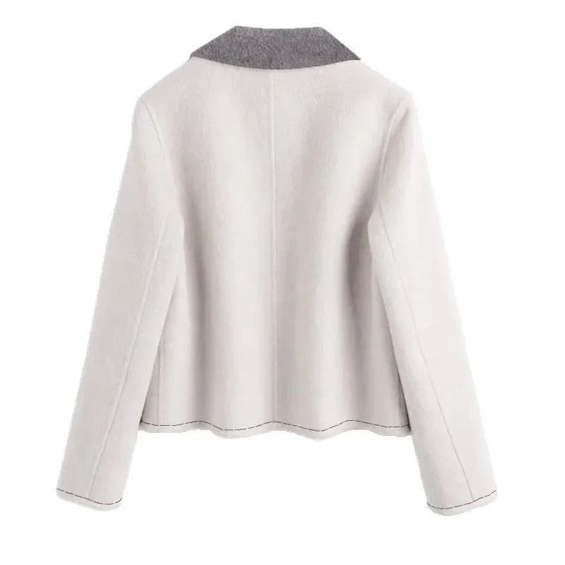 Back view of a light gray jacket on a white background