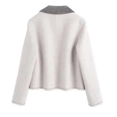 Back view of a light gray jacket on a white background