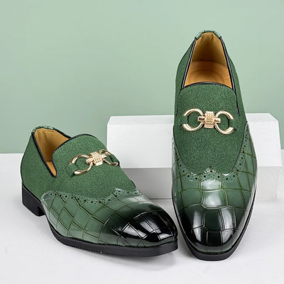 Green loafers with gold accents on a white and light green background