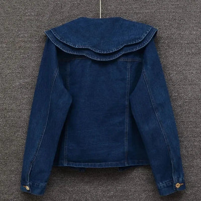 Back view of women’s casual denim jacket with relaxed fit and clean seams