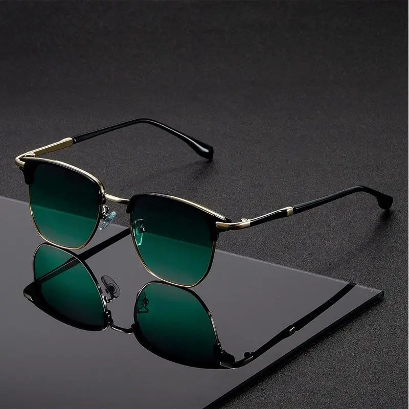 Sunglasses with green lenses on a reflective black surface