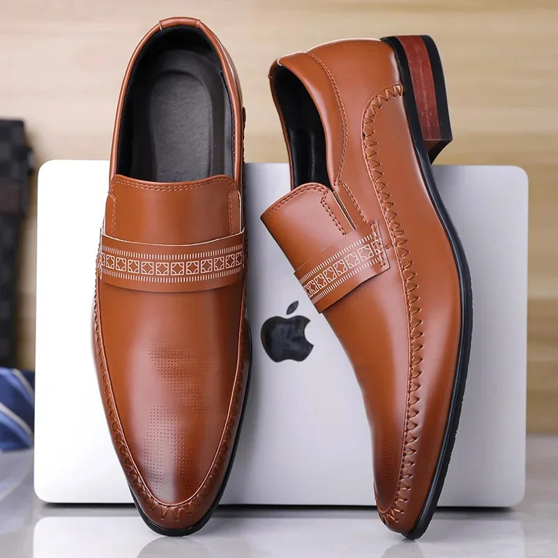 Pair of brown leather loafers on a white box with Apple logo
