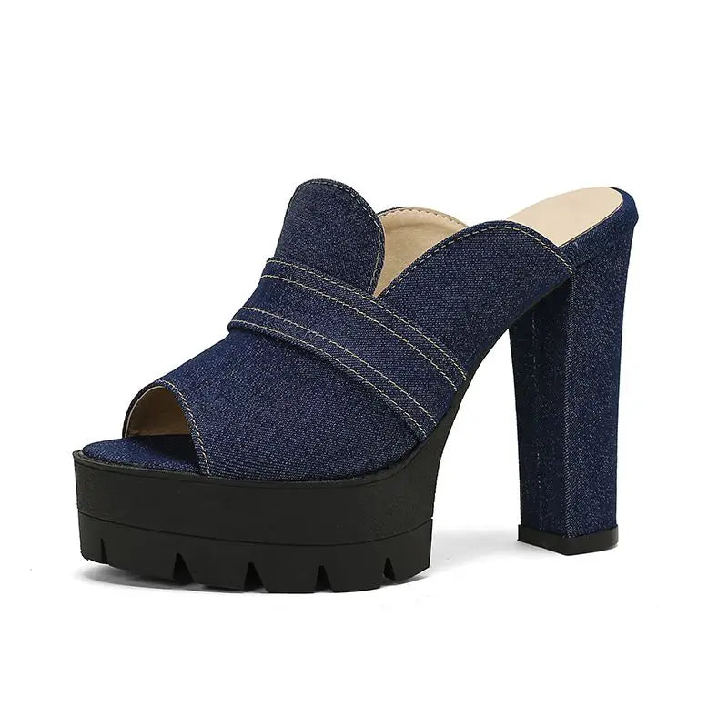 Denim platform sandal with a black sole on a white background