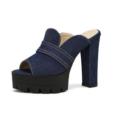 Denim platform sandal with a black sole on a white background