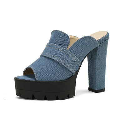 Denim platform sandal for women with a black sole on a white background