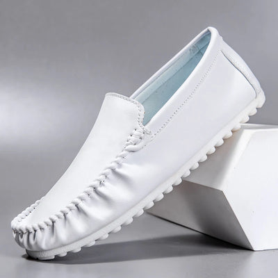 White loafers on a gray background