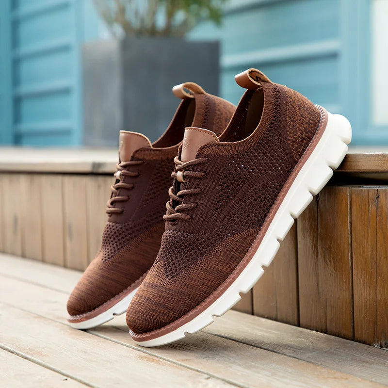 Brown sneakers with white soles on a wooden surface with a blurred background