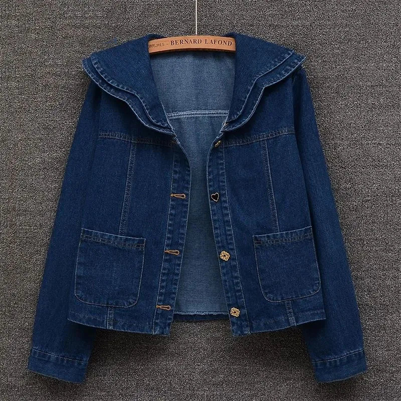 Front view of women’s denim jacket with doll collar and button-down front