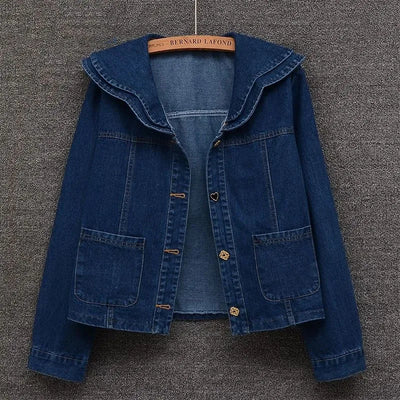 Front view of women’s denim jacket with doll collar and button-down front