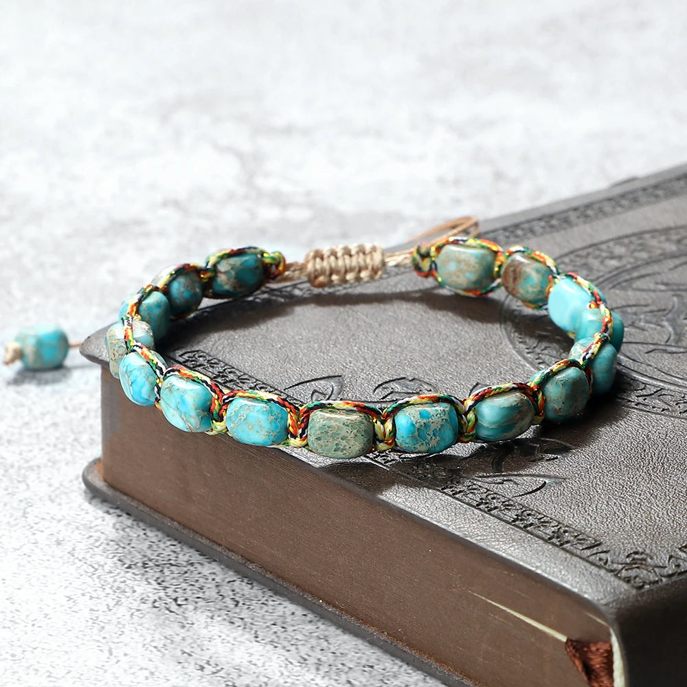 Turquoise beaded bracelet on a textured surface