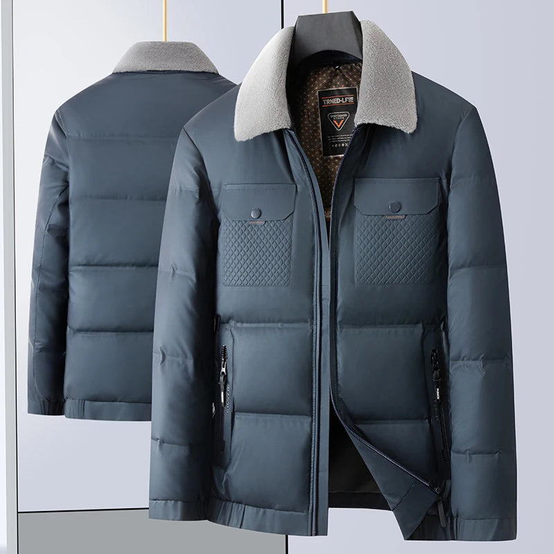 Gray puffer jacket with quilted design and gray fur collar on a light blue background