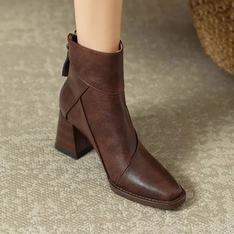 Brown ankle boot on a textured surface