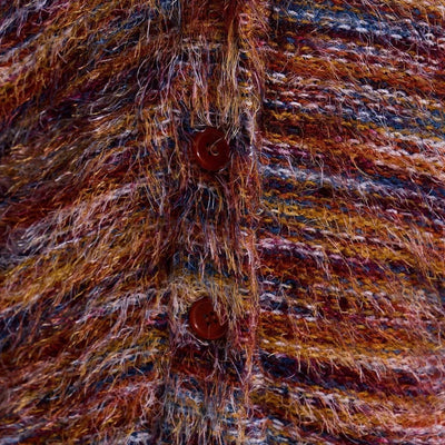Close-up of a textured fabric with brown and orange hues