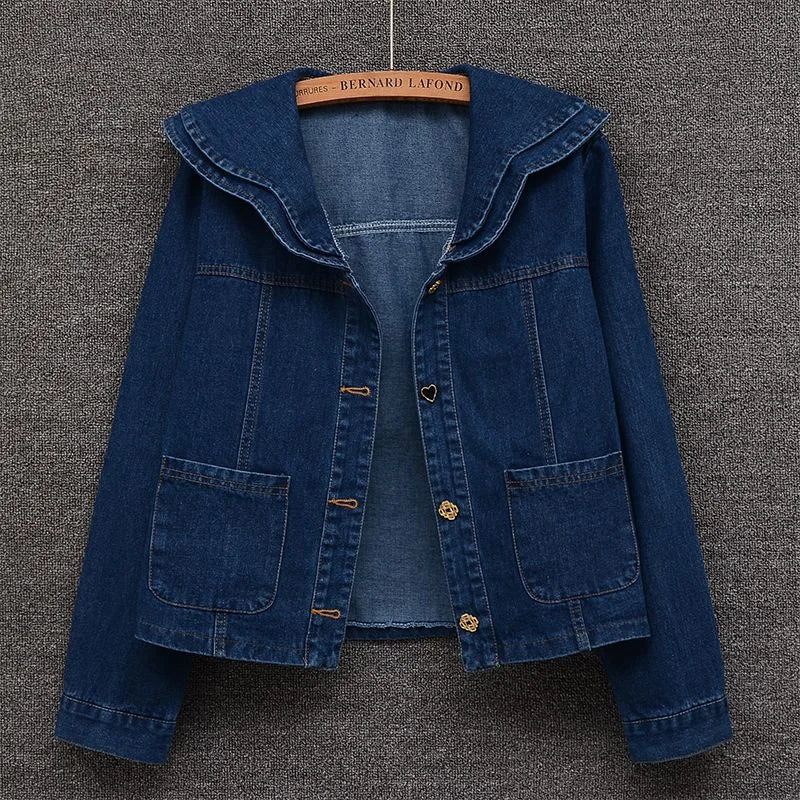Front view of women’s denim jacket with doll collar and button-down front