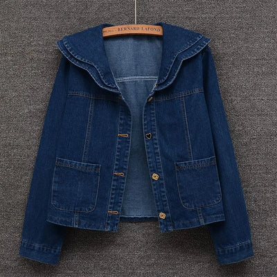 Front view of women’s denim jacket with doll collar and button-down front