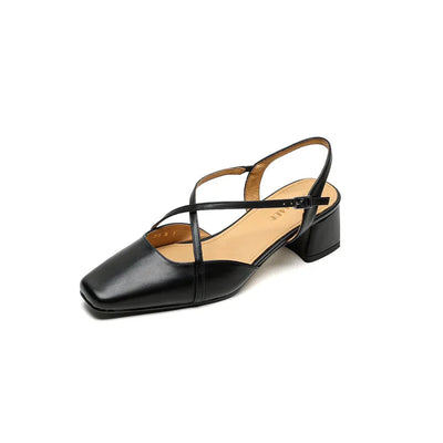 Black sandal with criss-cross straps on a white background