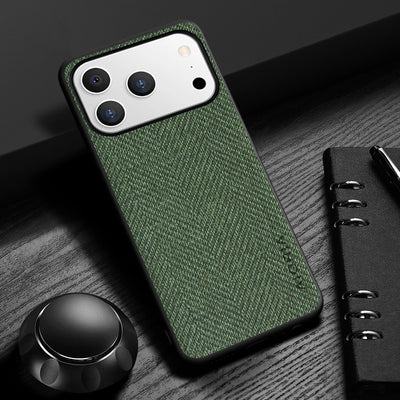 Green textured phone case on a smartphone with a pen and notebook in the background