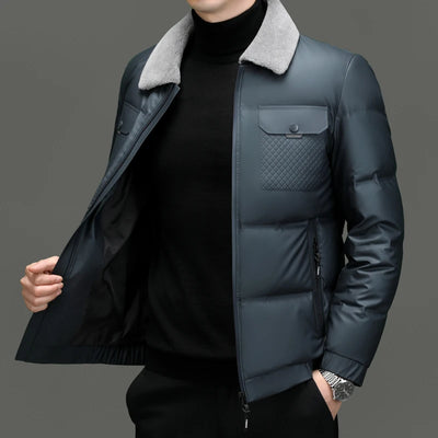 Dark blue jacket with gray collar and textured pocket on a gray background