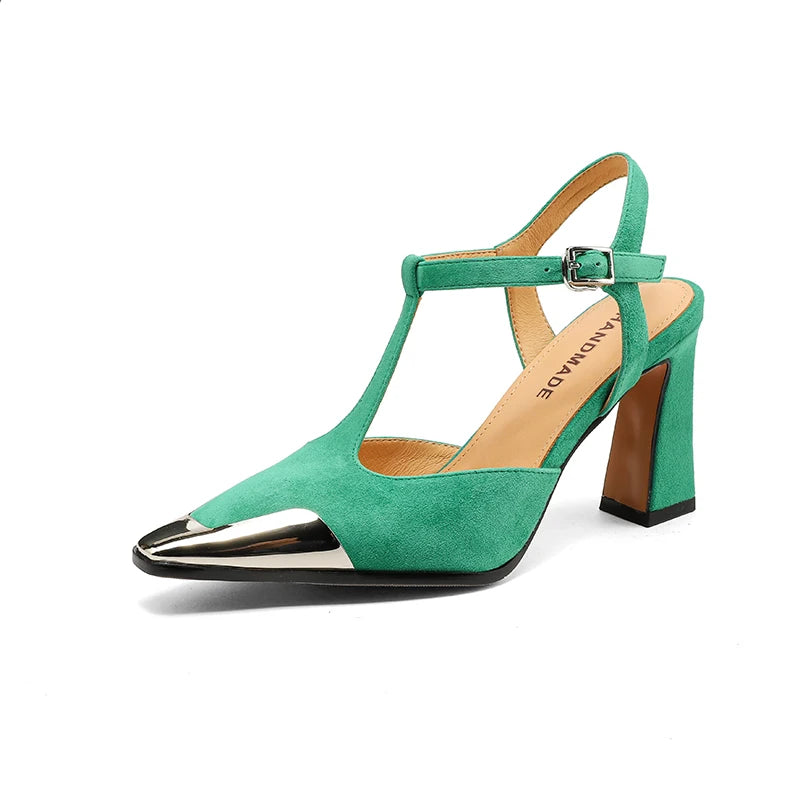 Green high-heeled shoe with metallic toe on a white background