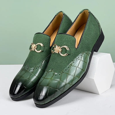 Green textured loafers with gold accents on a white and green background