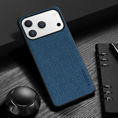 Blue textured phone case on a smartphone with a pen and notebook in the background