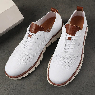 White sneakers with brown accents on a dark surface