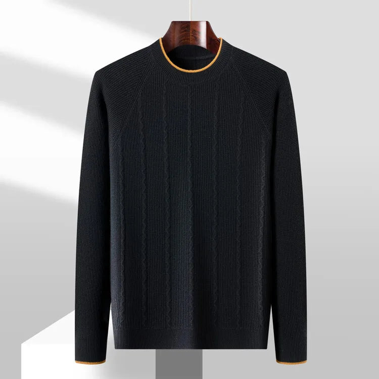 Black sweater on a hanger against a gray background