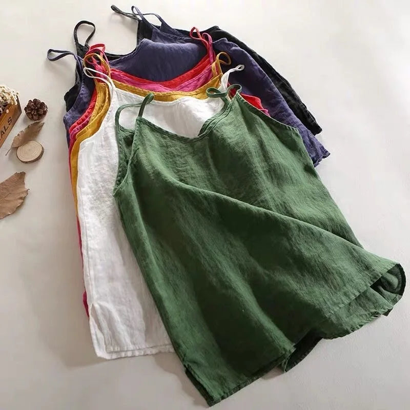 Colorful tank tops hanging on a white background