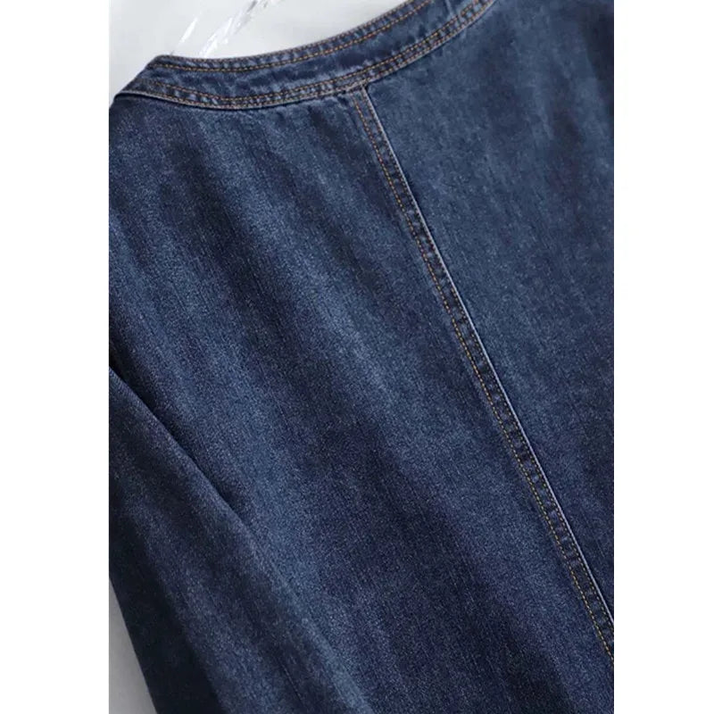 Close-up of blue denim fabric with a white background