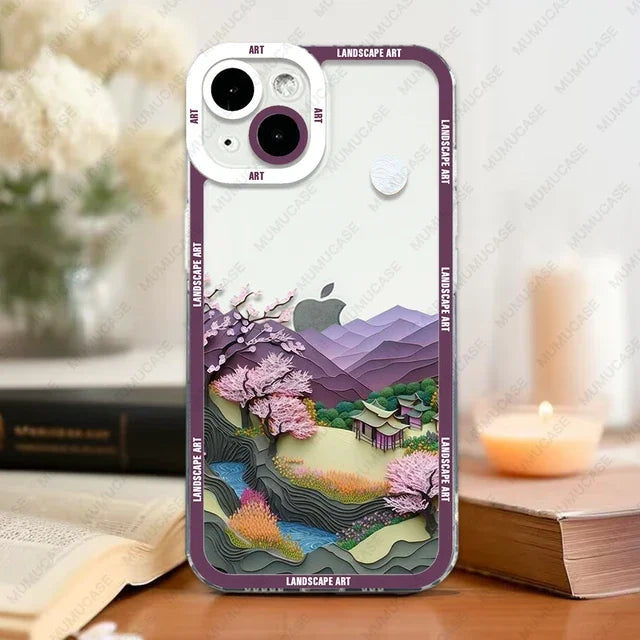Phone case with landscape design on a table with books and a candle