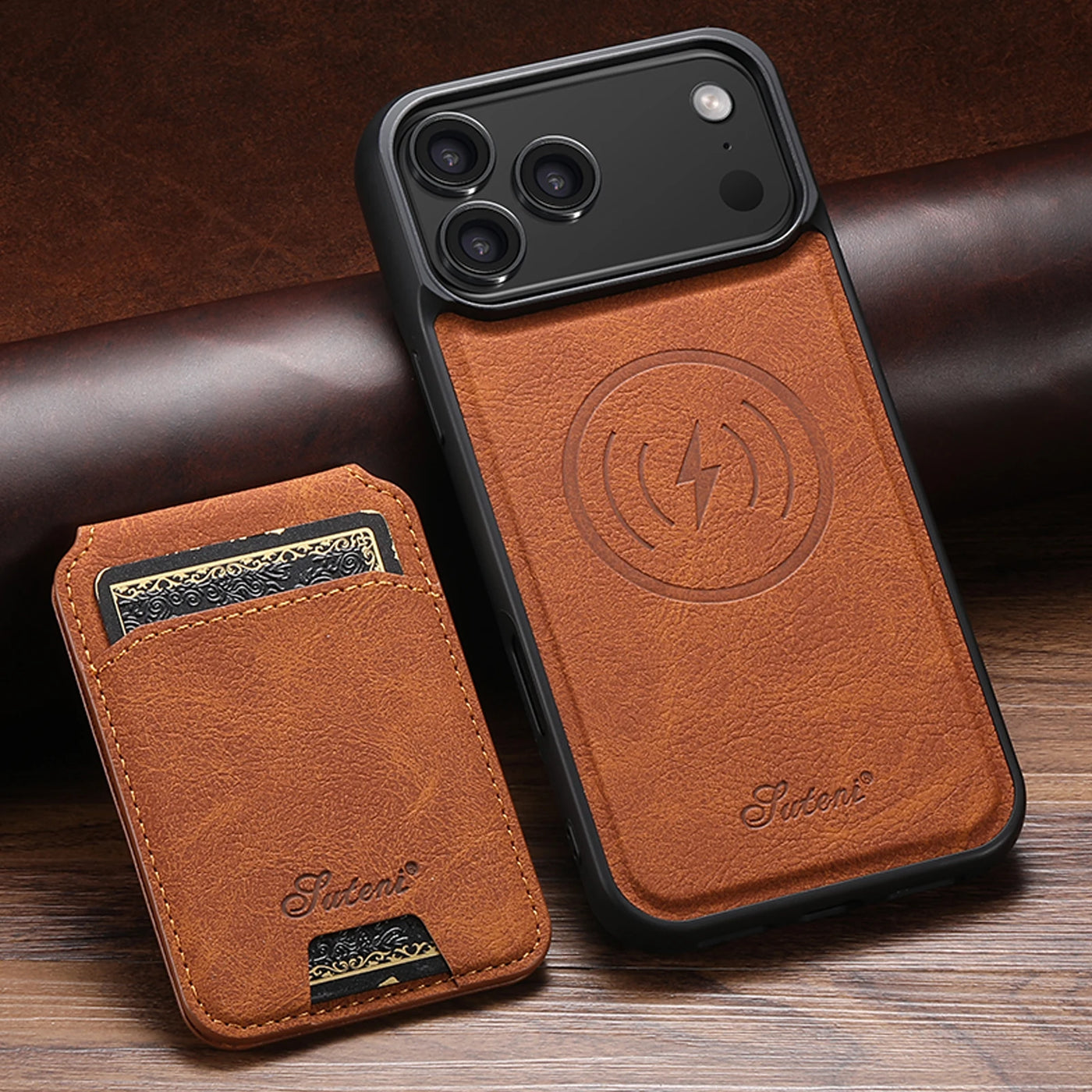 Brown leather phone case with brand logo on a wooden surface