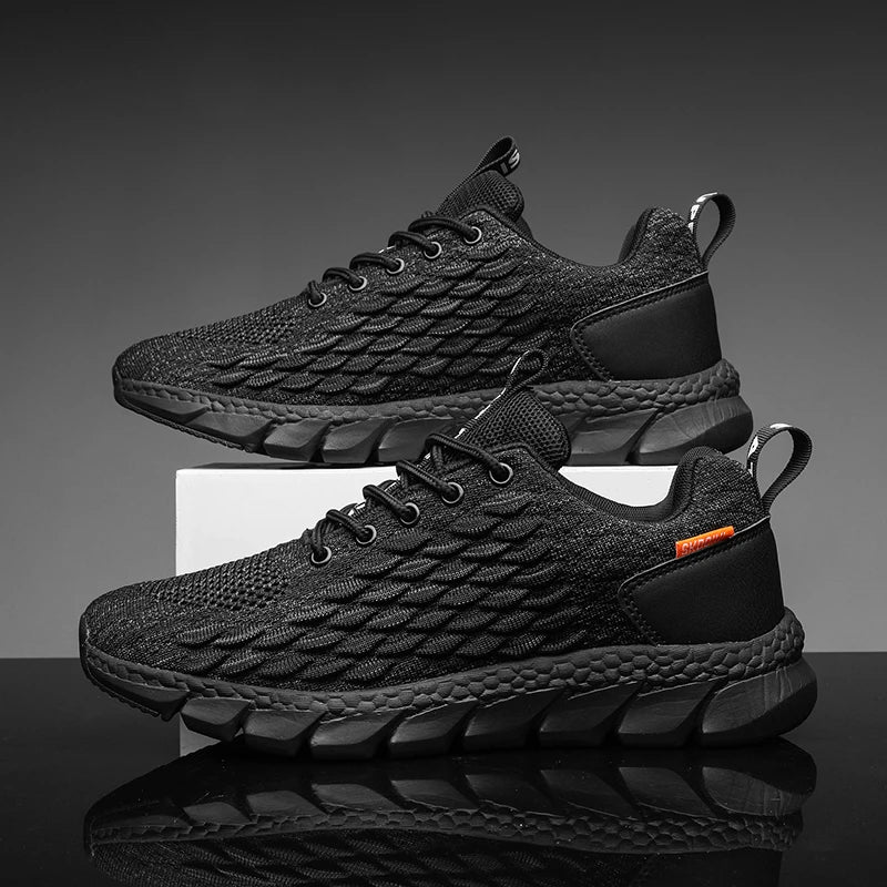 Black athletic shoes with textured design on a reflective surface and gray background
