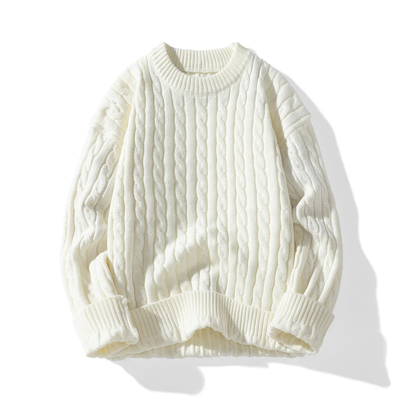 White cable knit sweater on a white background