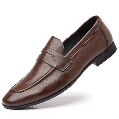 Brown leather loafer shoe on a white background