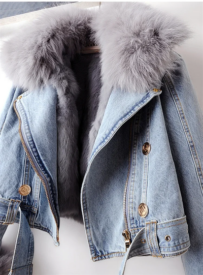 Denim jacket with fur trim on a white background