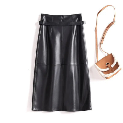 Black leather skirt with a brown and beige handbag on a white background