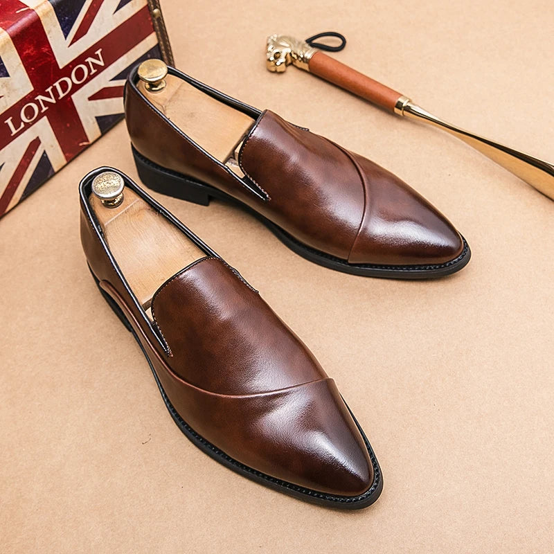 Brown leather shoes on a beige surface with a British flag and walking cane in the background.