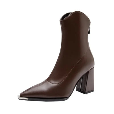 Brown ankle boot with a block heel on a white background