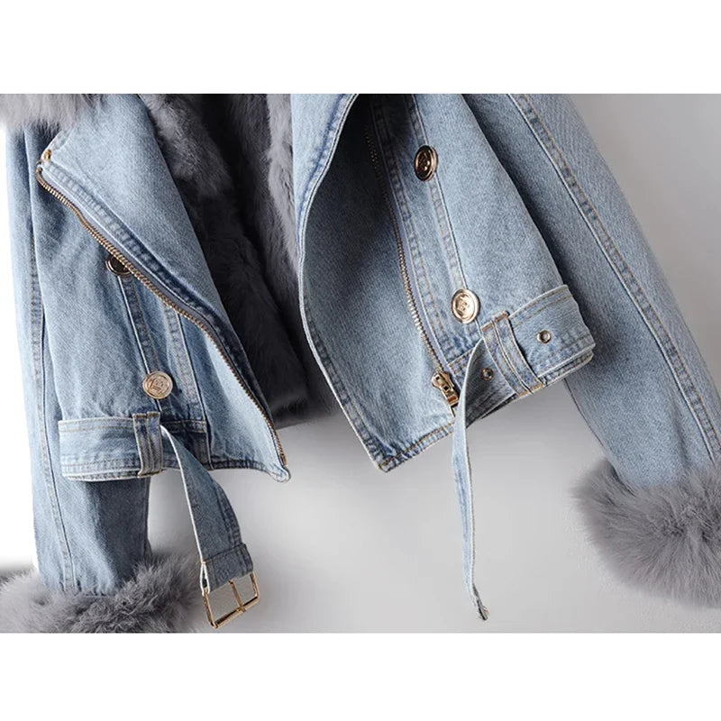 Light blue denim jacket with fur trim on a white background