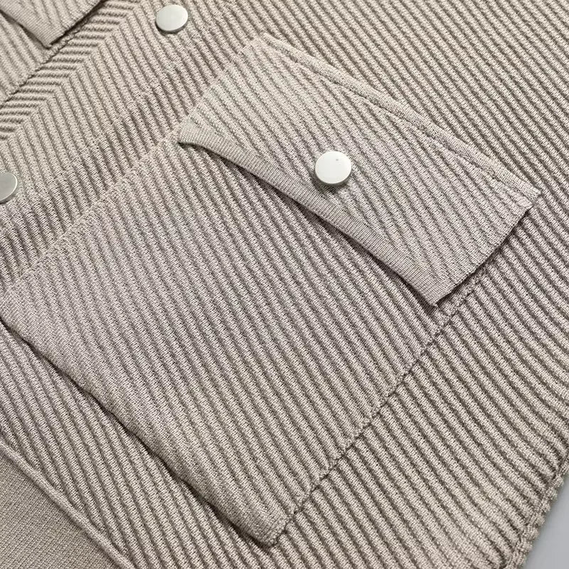 Close-up of a gray textured fabric with buttons