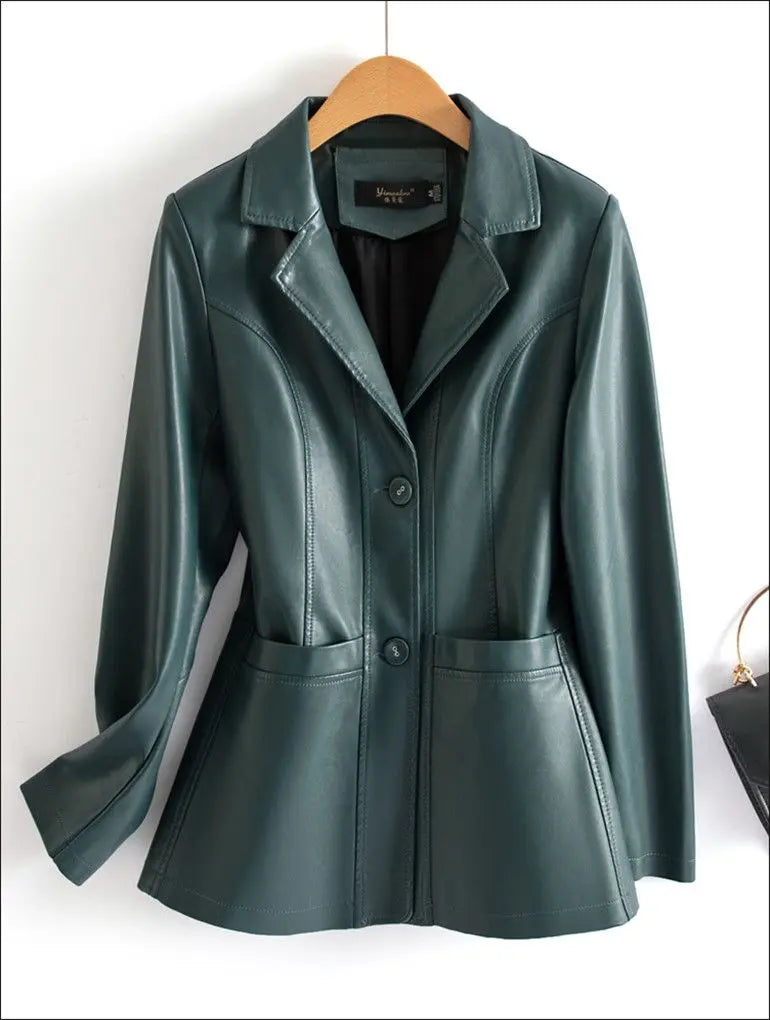 Green leather jacket on a wooden hanger against a white background