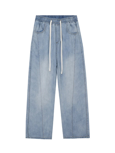 Light blue jeans with drawstring on a white background