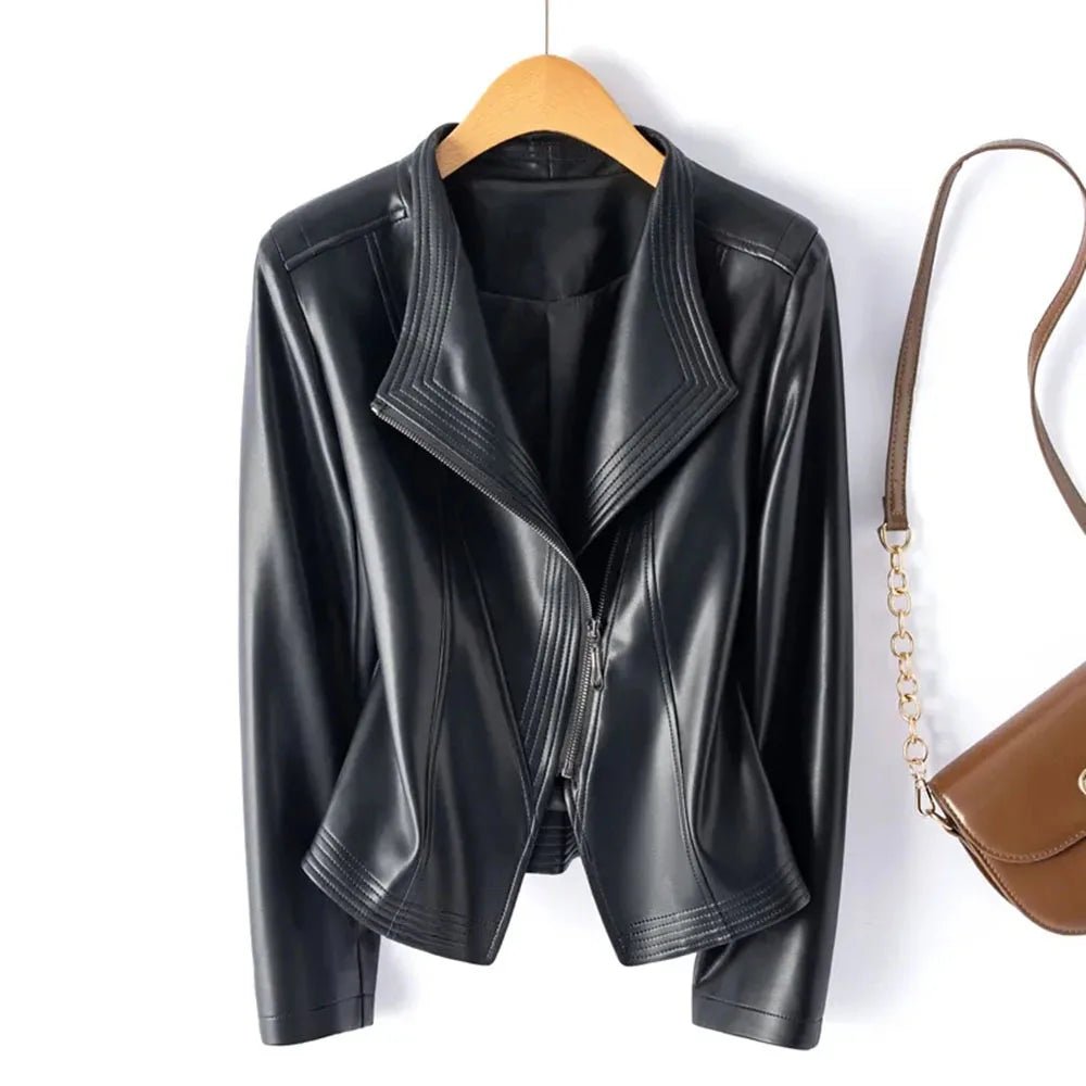 Black leather jacket on a hanger with a brown handbag on a white background