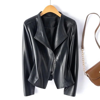 Black leather jacket on a hanger with a brown handbag on a white background